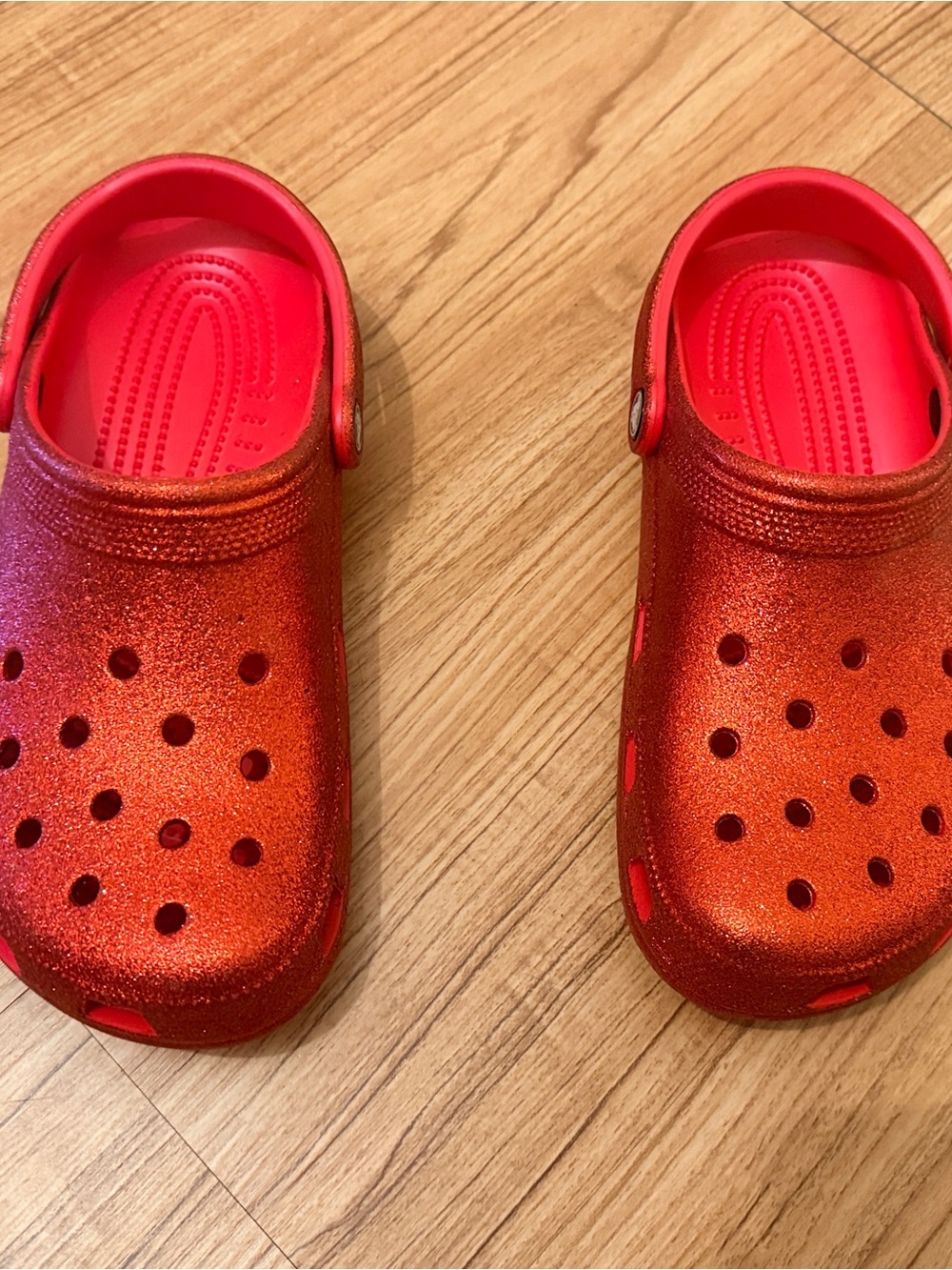 CROCS Woman’s Glitter Clogs in Shimmering Red